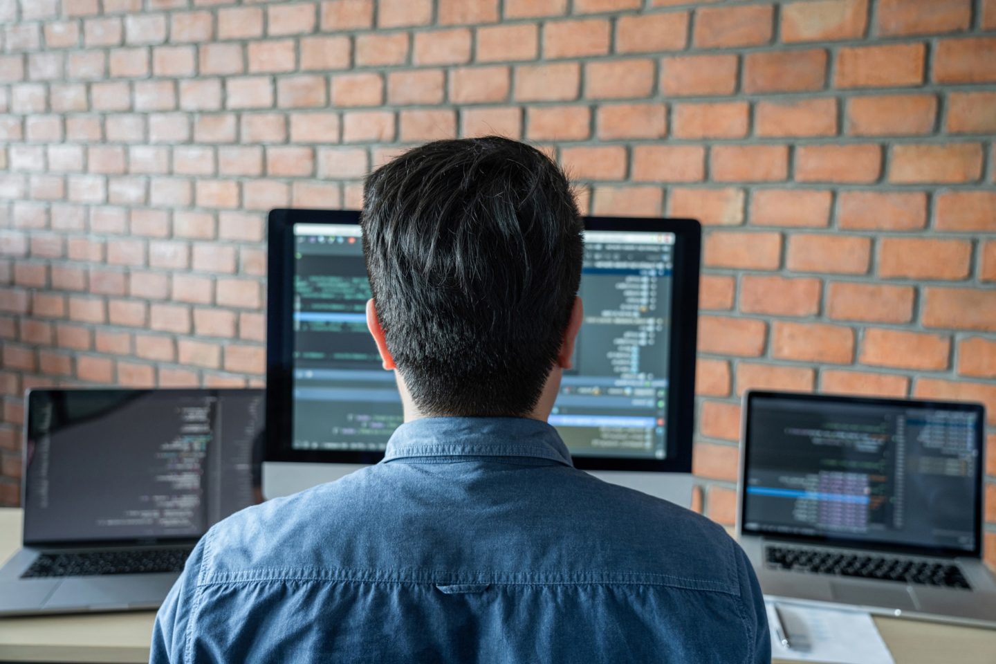 Young Professional programmer working at developing programming and website working in a software